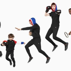 Complex multi-clipping path service applied to a sports apparel group photo, isolating multiple models and props for color correction.